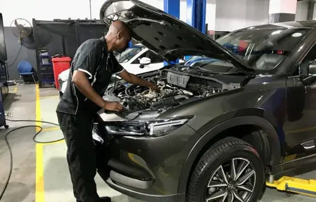 cmh-mazda-menlyn-technician-working-on-a-car